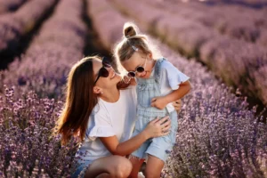 A mother and child in a field of flowers